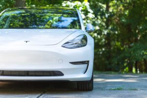 Image of the front of a white Tesla car