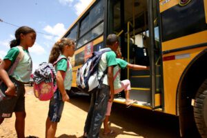 Image of children boarding a school bus