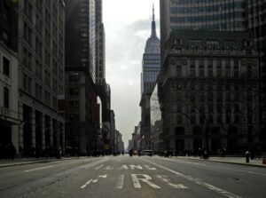 Image of city street surrounded by tall buildings