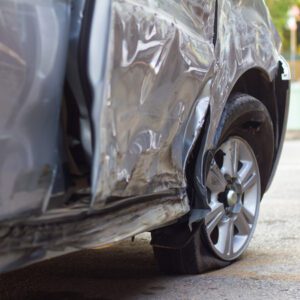 Image of a damaged vehicle with a flat tire