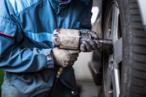 Image of person changing a tire with an impact