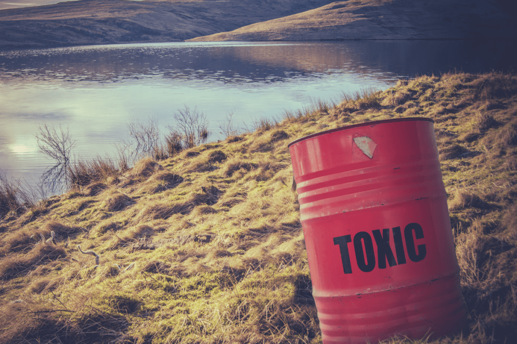 Image of toxic waste barrel near water