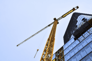 Image of building under construction and large crane