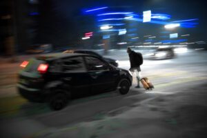 Image of pedestrian walking across the street