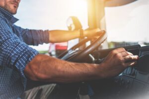 Image of man driving a semi truck