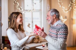 Image of man giving woman a gift