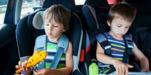 Image of two children in car seats