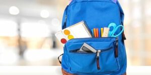 Image of a backpack filled with school supplies