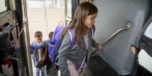 Image of children boarding a school bus