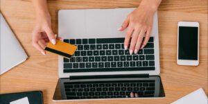 Image of a woman making an online payment on a laptop