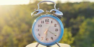 Image of clock in nature setting