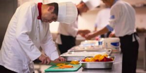 Image of chefs cooking in a professional kitchen