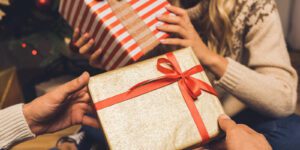 Image of two people exchanging gifts