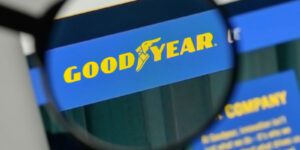 Image of magnifying glass looking at the goodyear tires photo on a computer screen