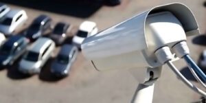 Image of security camera overlooking parking lot filled with cars