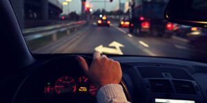 Image of man driving a car