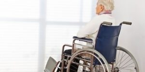 Image of elderly woman in a wheelchair