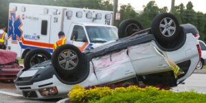 Image of rollover collision with ambulance and paramedics