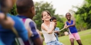 Image of children playing tug of war