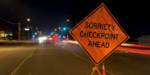 Sobriety Checkpoint Ahead sign on the road