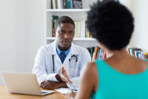 Image of medical professional speaking to woman