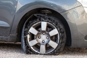 Image of car with a flat tire