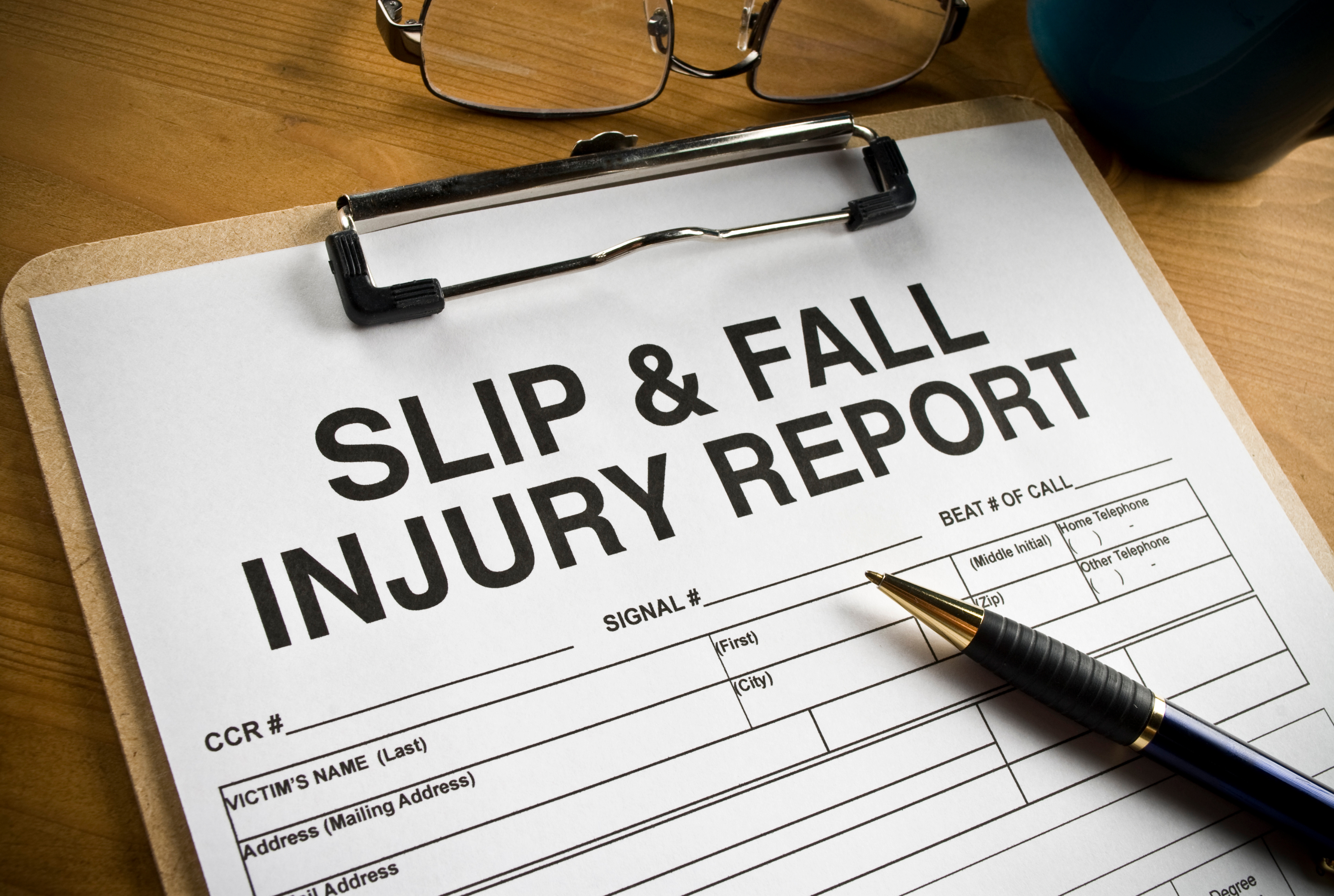 Image of slip and fall injury report on a clipboard