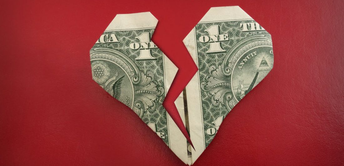 Image of dollar bill folded in the shape of a broken heart