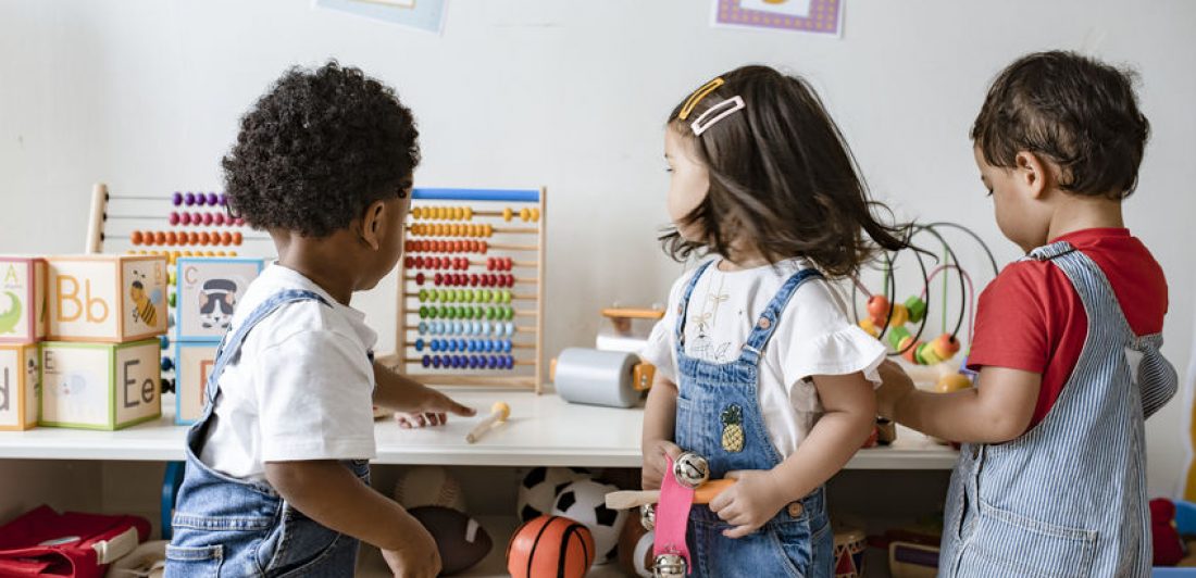 Image of preschoolers playing with toys in a classroom