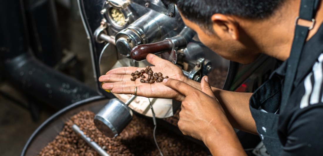 Image of man holding coffee beans