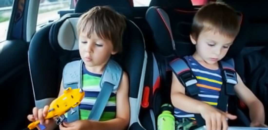 Image of two children in car seats