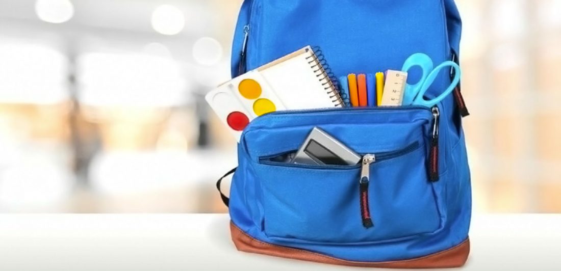 Image of backpack with school supplies inside