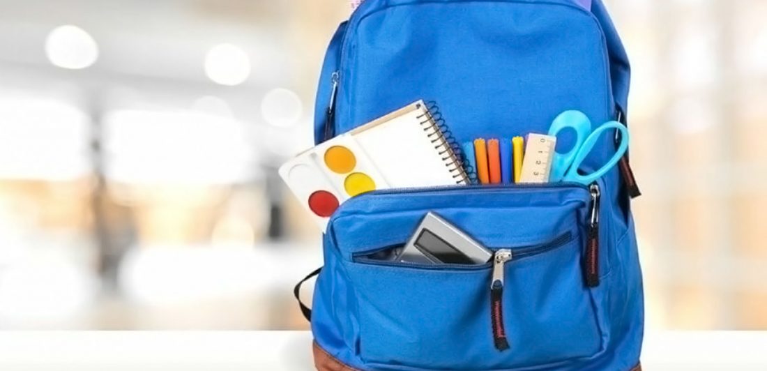 Image of a backpack filled with school supplies