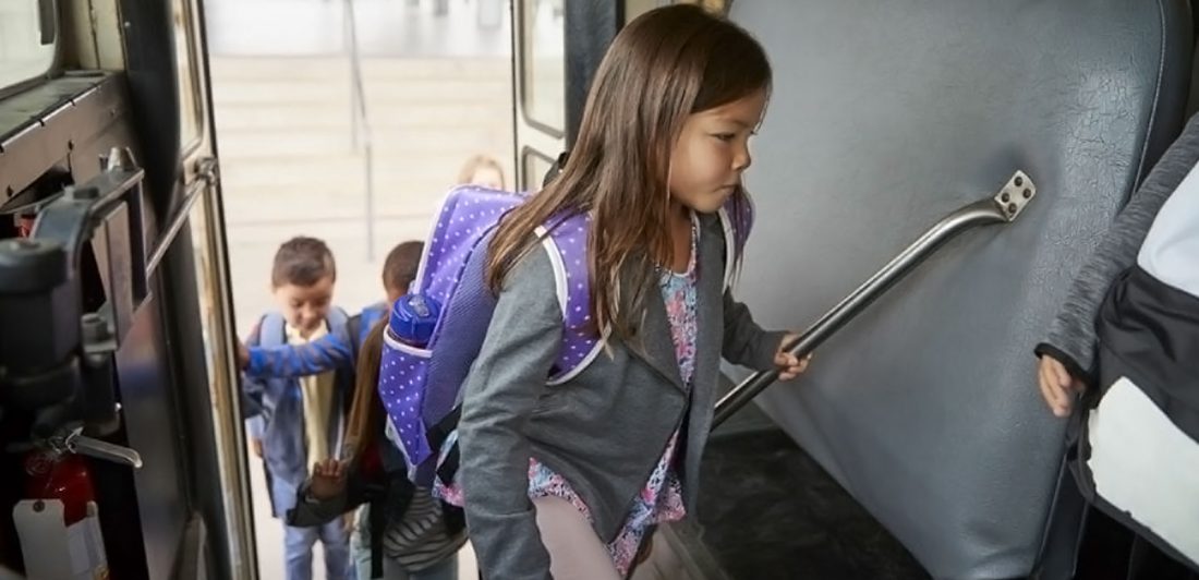 Image of children boarding a school bus