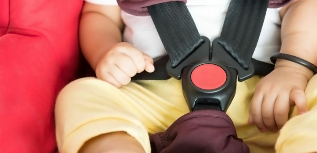 Image of infant buckled in car seat