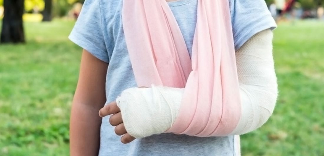 Image of person with arm cast and sling