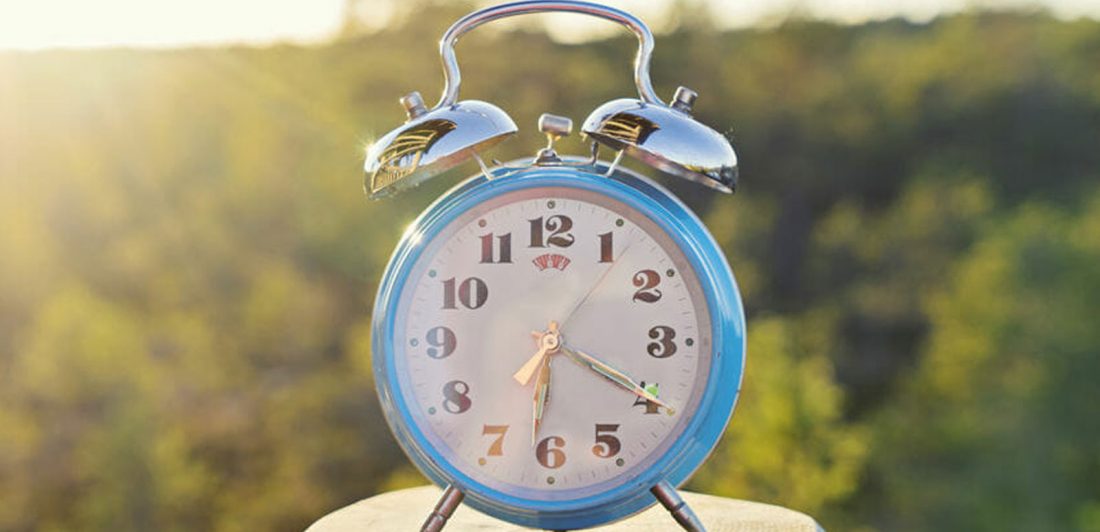 Image of clock in nature setting