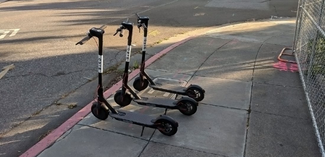 Image of dockless scooters on a sidewalk