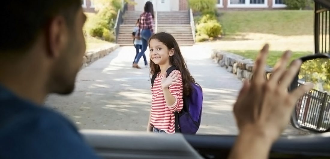 Image of person dropping child off at school