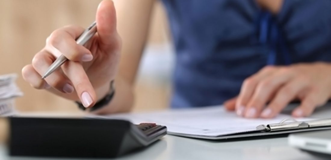 Image of woman doing calculations