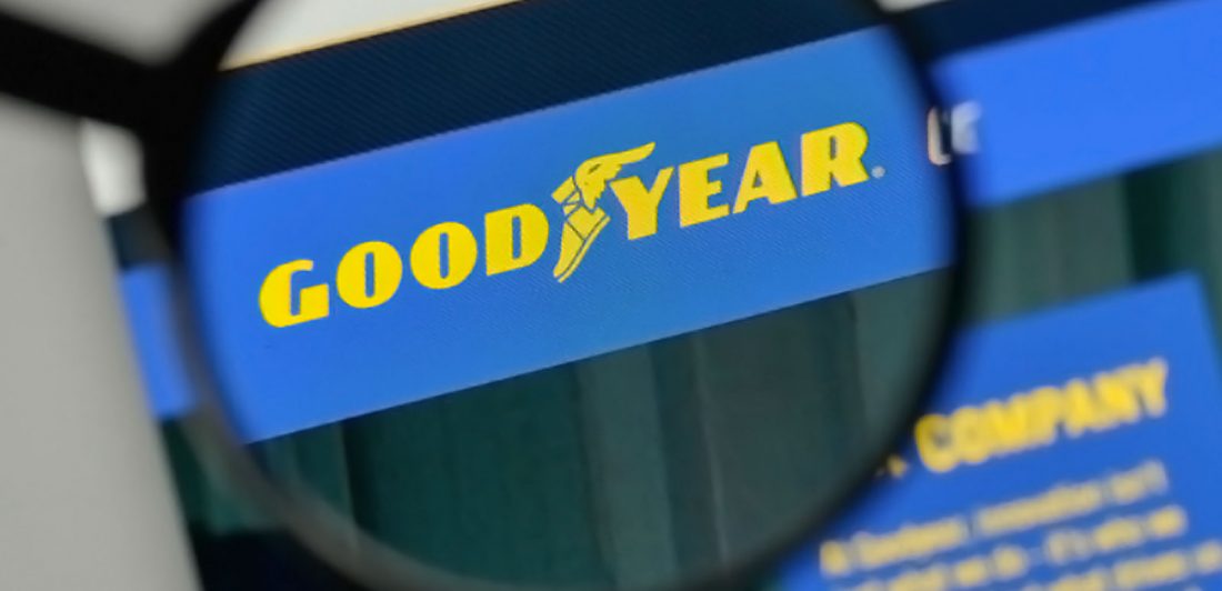 Image of magnifying glass looking at the goodyear tires photo on a computer screen