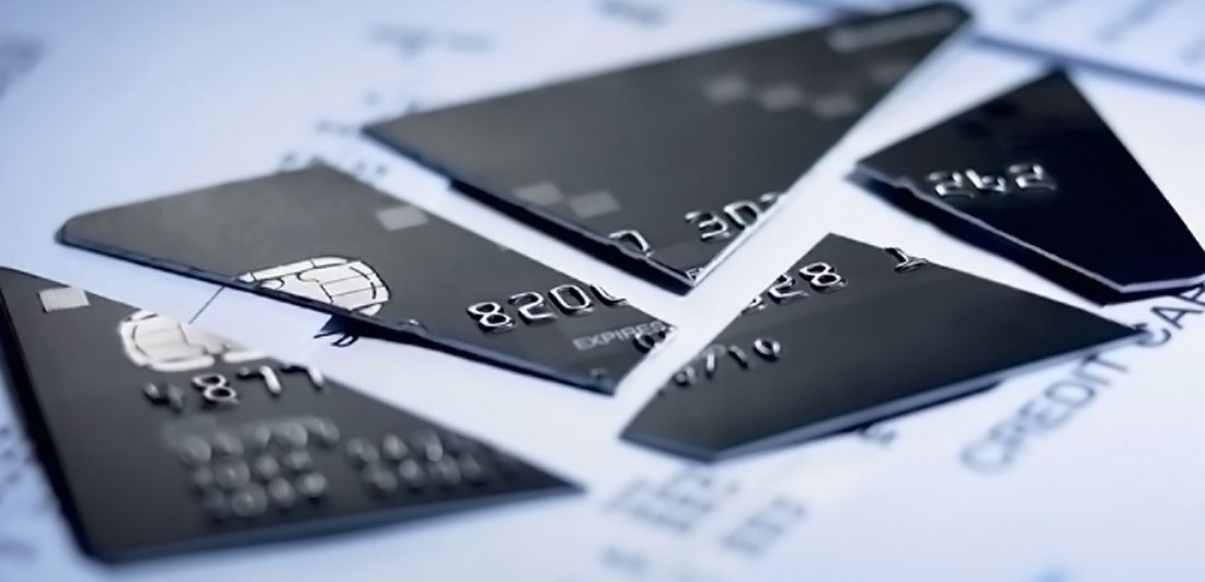 Image of cut up black credit card