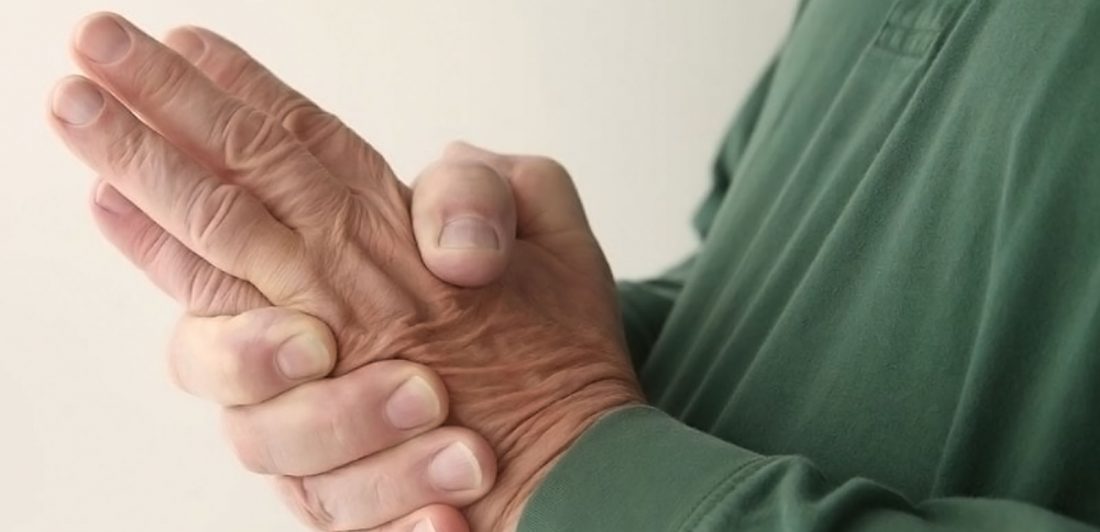 Image of older person rubbing their hands together