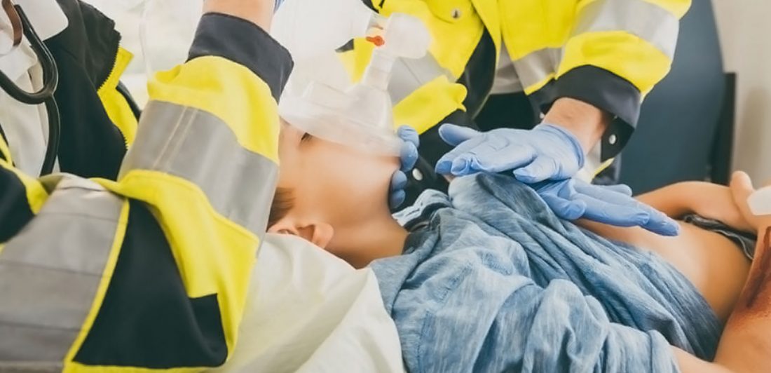 Image of paramedics performing CPR on child