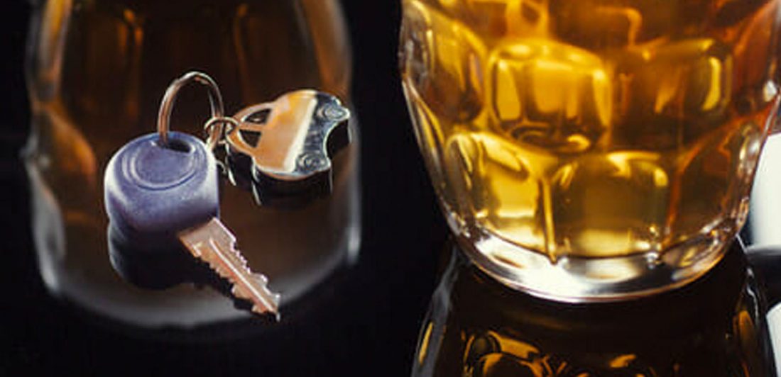 Image of glass of alcohol and car keys