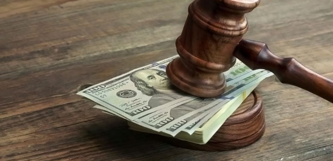 Image of a stack of 100 dollar bills under a gavel