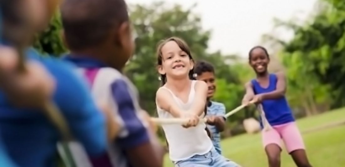 Image of children playing tug of war