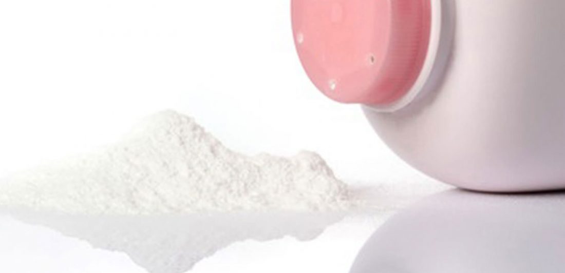 Image of talcum powder spilling from pink bottle