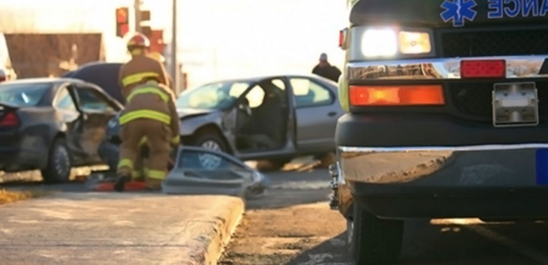 Image of vehicle collision with paramedics and ambulance