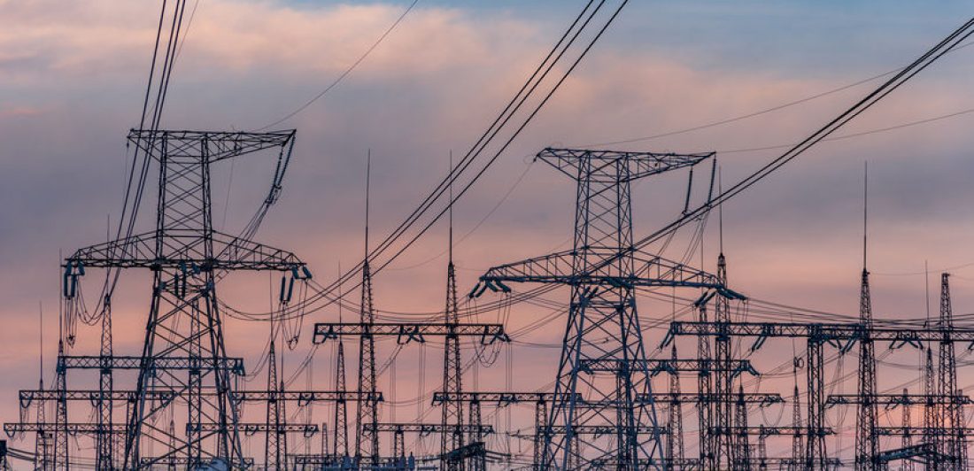 Image of high voltage power lines at sunset